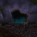 Female Pandaren in front of a cave